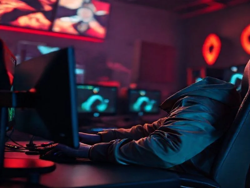 Holographic display projecting complex 3D models of interconnected game mechanics.